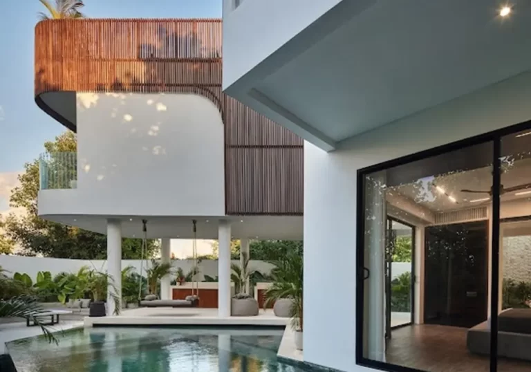 Oceanfront pool and luxury facade of a five-bedroom villa in Berawa, listed by Martin Spies with Nest Seekers LLC