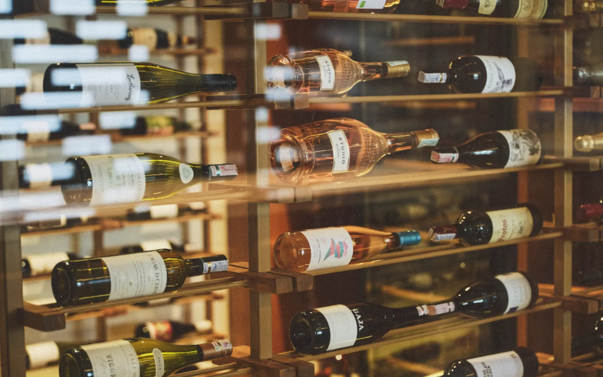 Close-up of wine bottles stored in the climate-controlled wine cellar at BASK Gili Meno