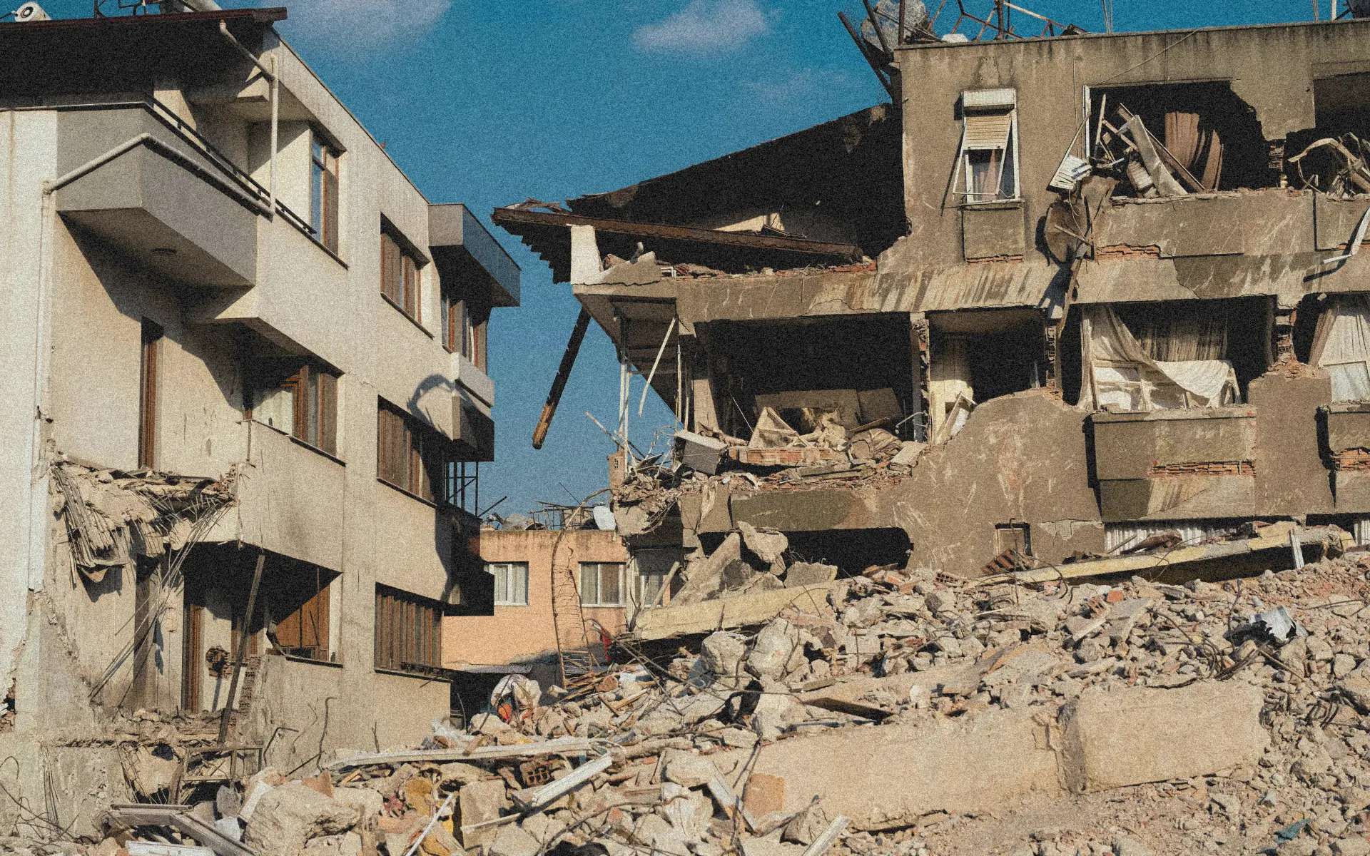 Partially demolished buildings surrounded by rubble in Bali.