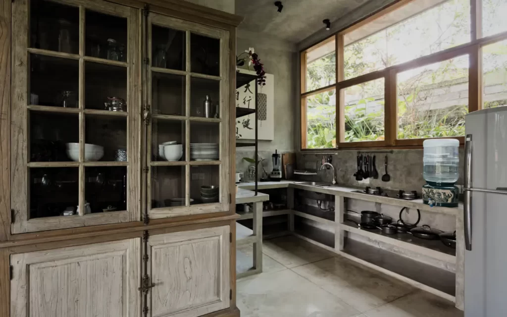 Whitewashed kitchen at RiverView Gardens with jungle views and vintage-style fridge