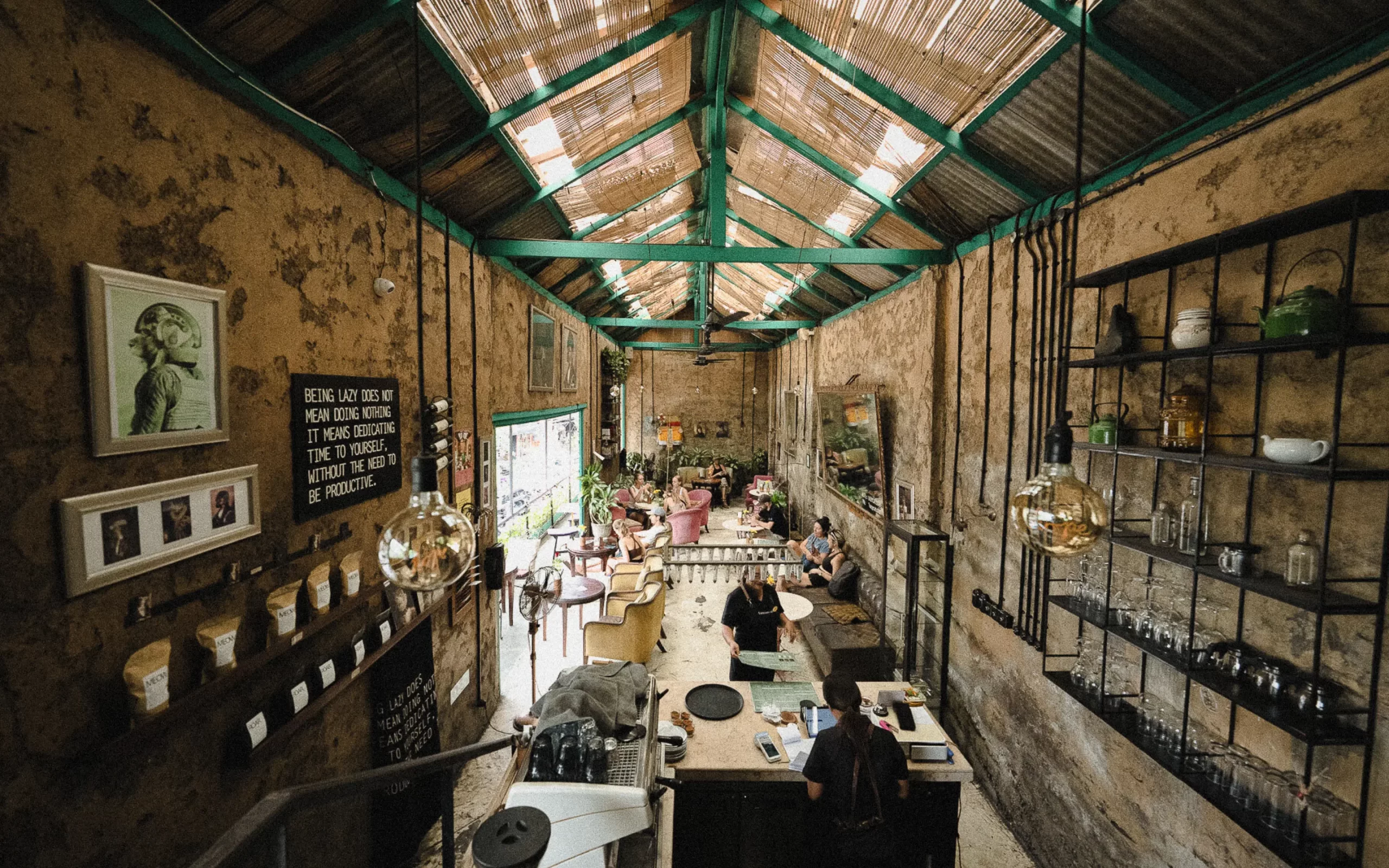 Overhead view of Lazy Cats Ubud showing its vintage-inspired living room, plants, eclectic décor, and cozy boho atmosphere.