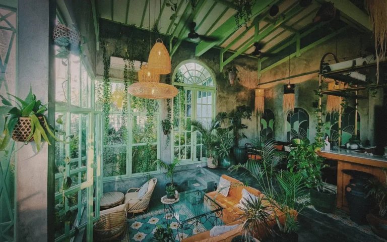 Biophilic café interior filled with natural light and tropical plants