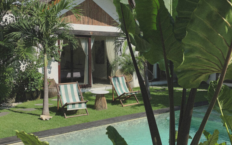 Established tropical garden surrounding a Bali villa with mature trees and pool