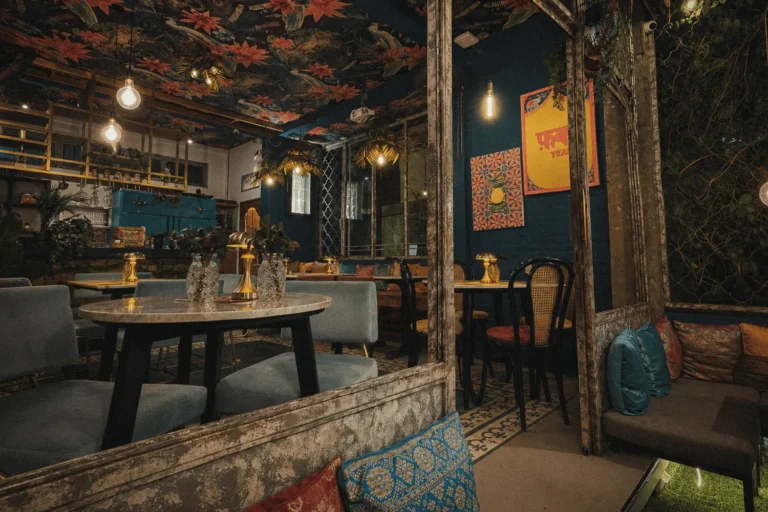 Interior of Pesona Lounge, an Indian restaurant on Goutama Street in Ubud, with warm lighting, eclectic décor and lounge seating.