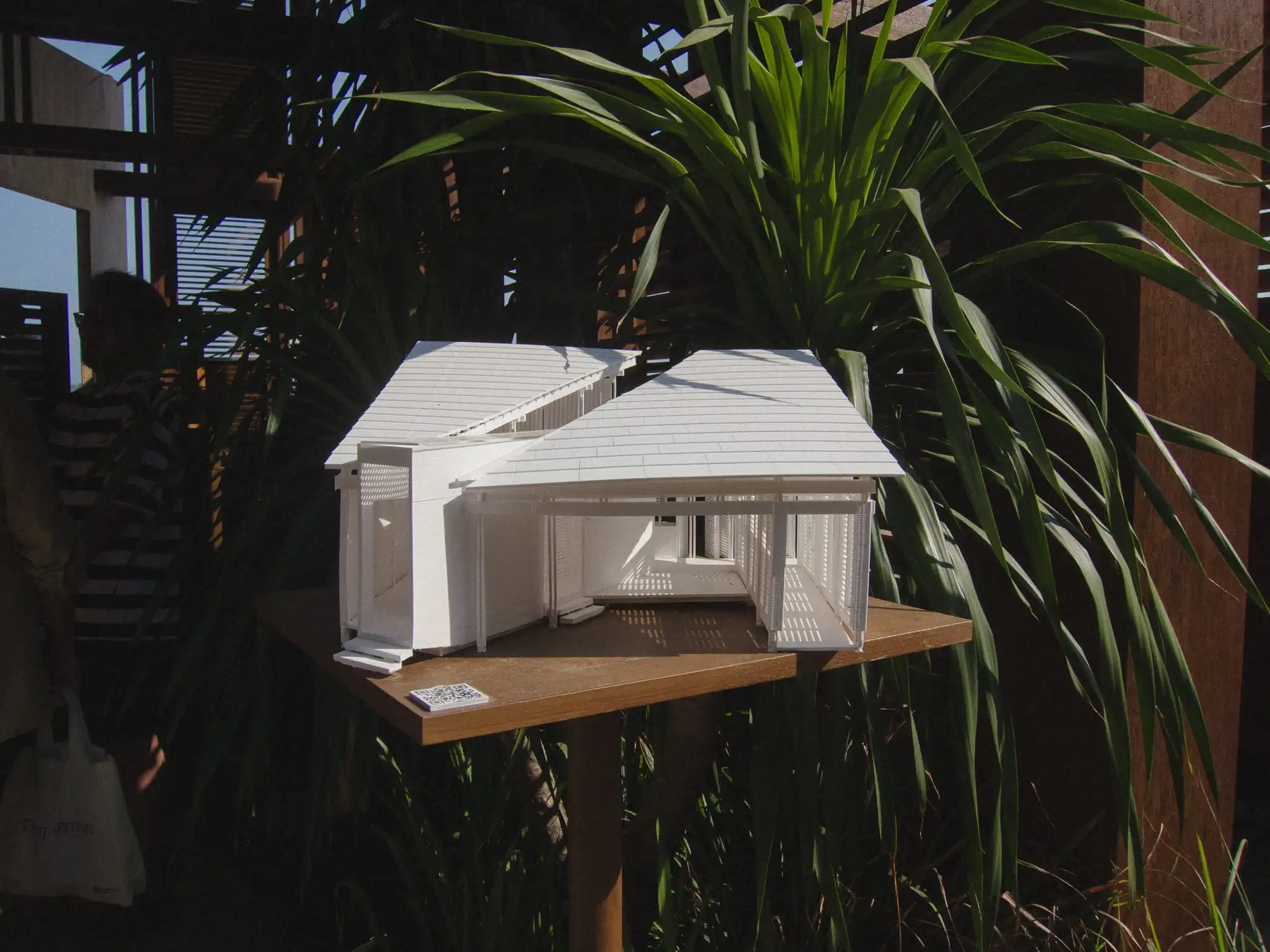 White architectural model surrounded by tropical plants at Jia Curated 2026 in Bali
