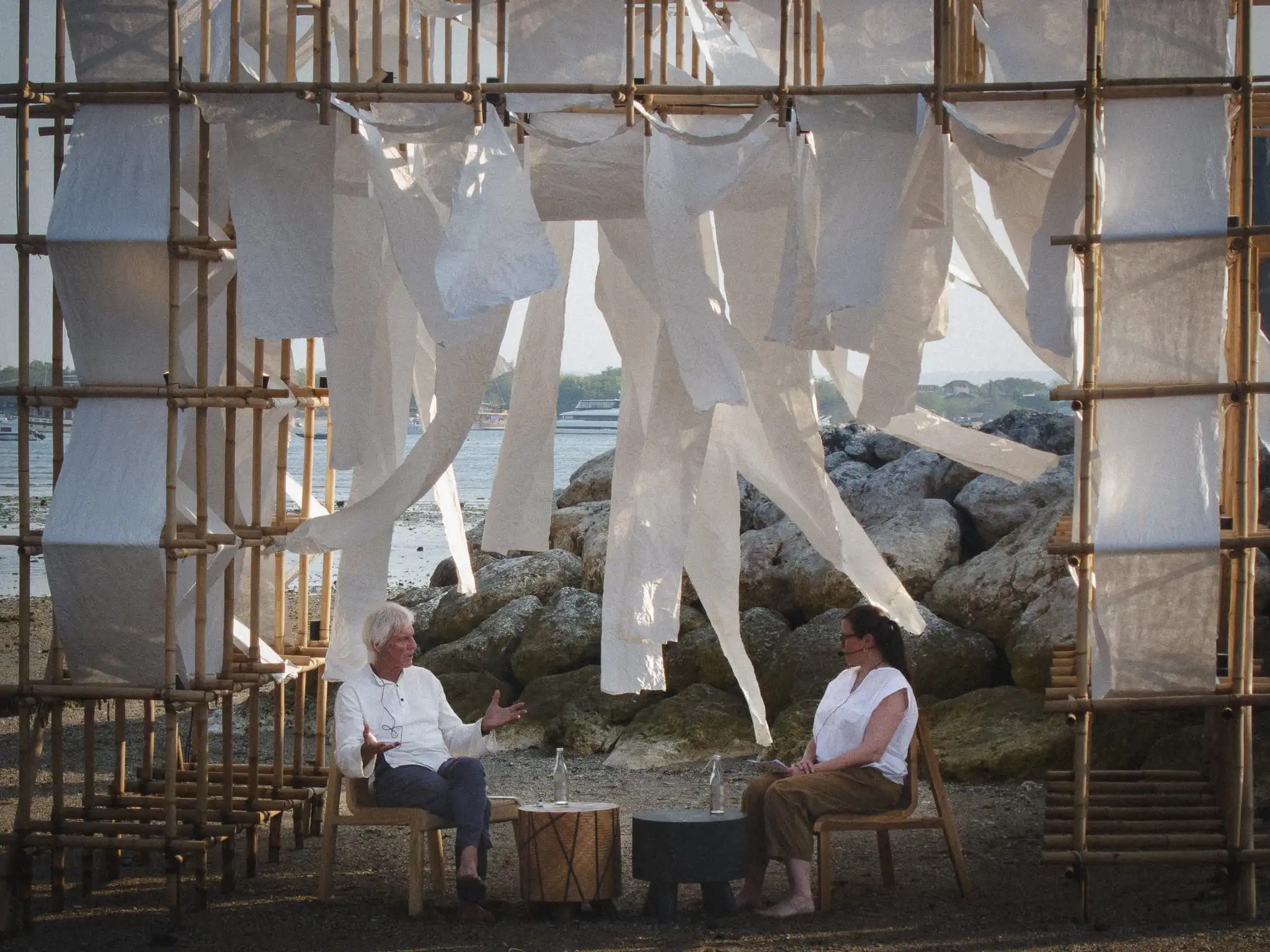 Architect Peter Stutchbury in conversation with Suzy Annetta on the beachfront stage at Jia Curated 2026