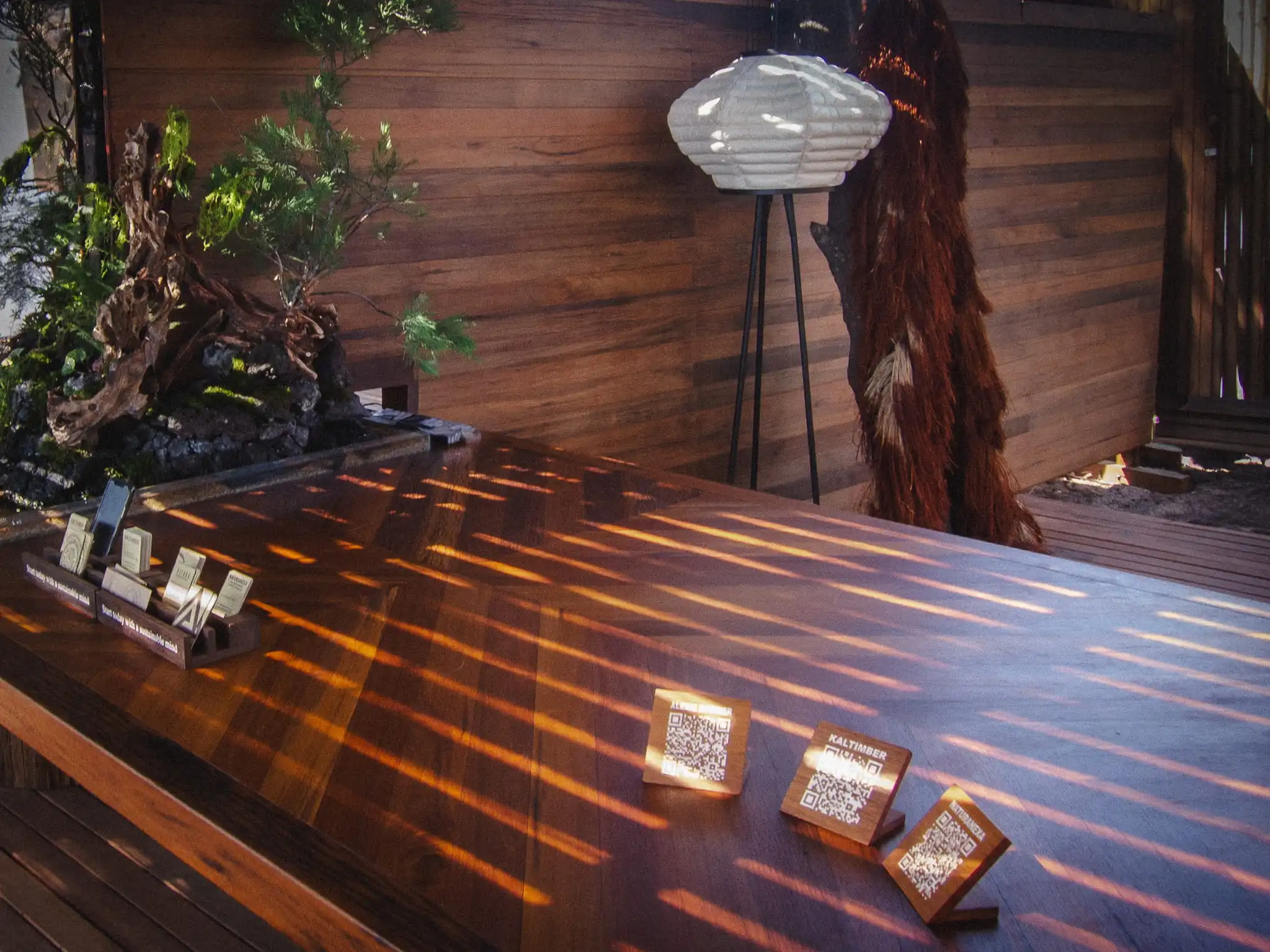 Reclaimed timber and landscaping inside the Second Growth pavilion by Kaltimber and Alexis Dornier