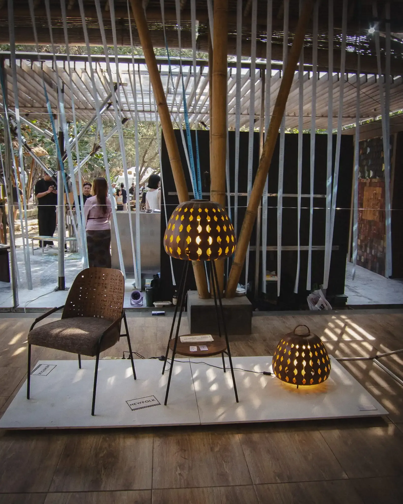 Furniture and illuminated objects displayed in Newfolk’s TOMORROW exhibition at Jia Curated 2026
