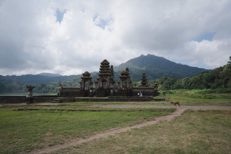 Balinese temple complex with a mountain and tropical forest in the background